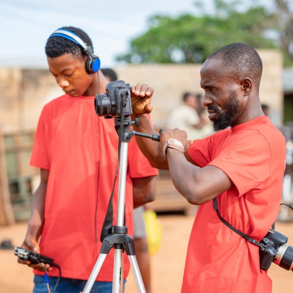 Image,Of,African,Guy,,With,Camera,And,A,Colleague,At